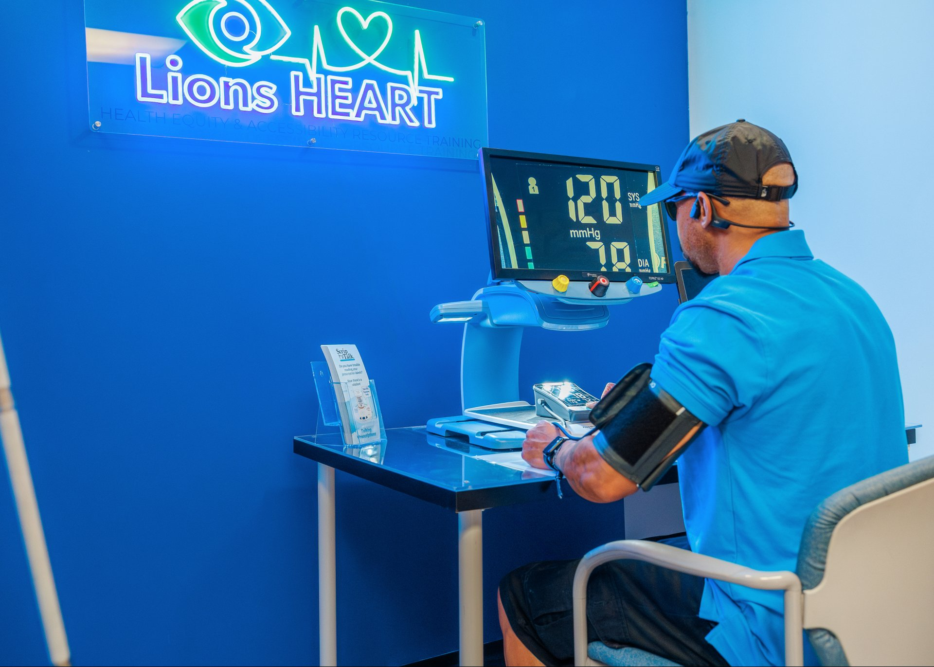 Lions Services employee using the LionsHEART adaptive medical station