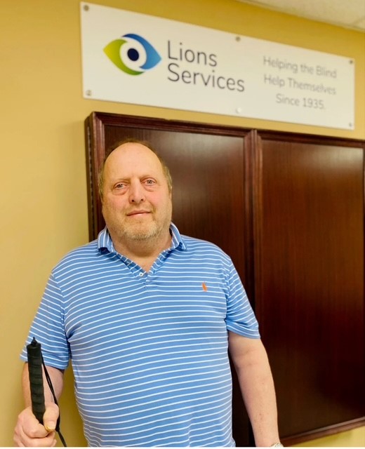 Photo of John Purser, who found employment and mobility training at Lions Services after losing his vision in a fall