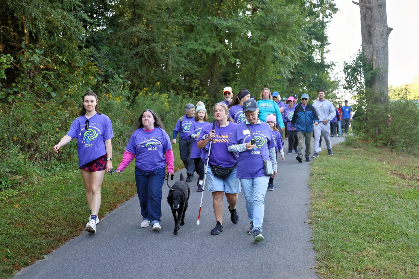 Community members at the 2025 Braille Trail Walk packet pickup